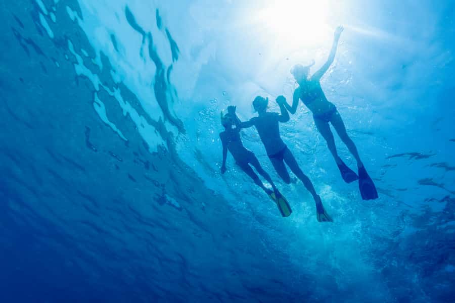 Cartagena: Snorkel, Mangroves and Playa Blanca Tour - Boarding the boat near Playa Blanca