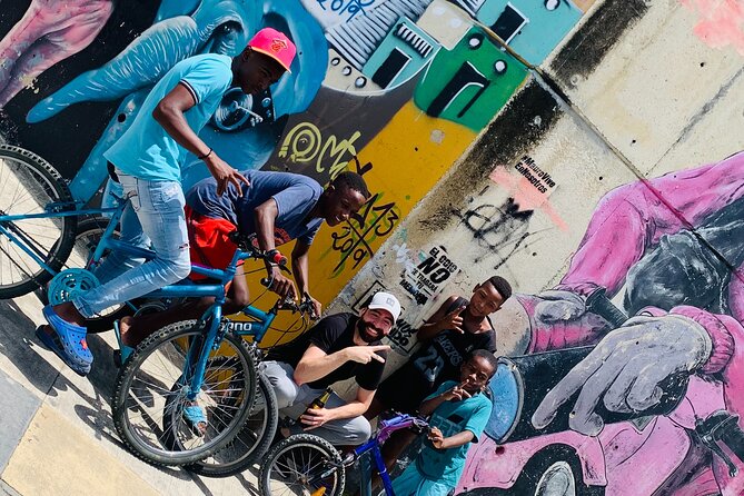 Commune 13, Graffitour street food. History.All inclusive - Street food, mango ice cream, and small local stops