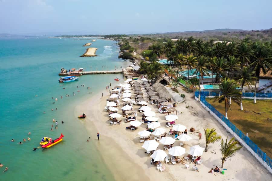 From Cartagena: Palmarito Beach With Buffet Lunch And Pool - Timing, language, and what to bring