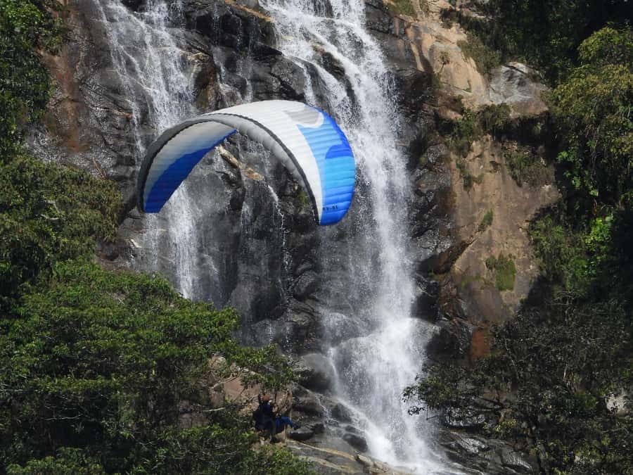 From Medellín: Paragliding Flight and Guatape Tour - Paragliding above Cocorna’s waterfalls