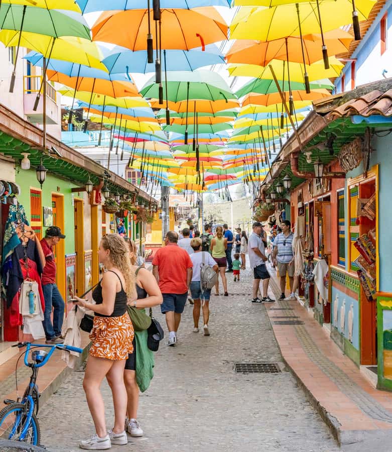 Guatapé Tour by Chiva + Visit to Pablo Escobar's Hacienda - El Peñol adds food and a village pause
