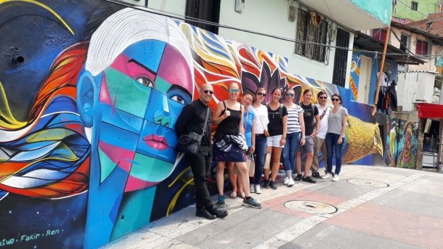 Medellín: Comuna 13 District Tour with Cable Car Ride - Outdoor escalators, steep walks, and the observation deck