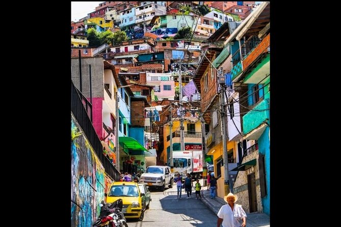 Medellín: Comuna 13 Tour with Spray Painting and ice cream - Murals, alleys, and the story behind the color