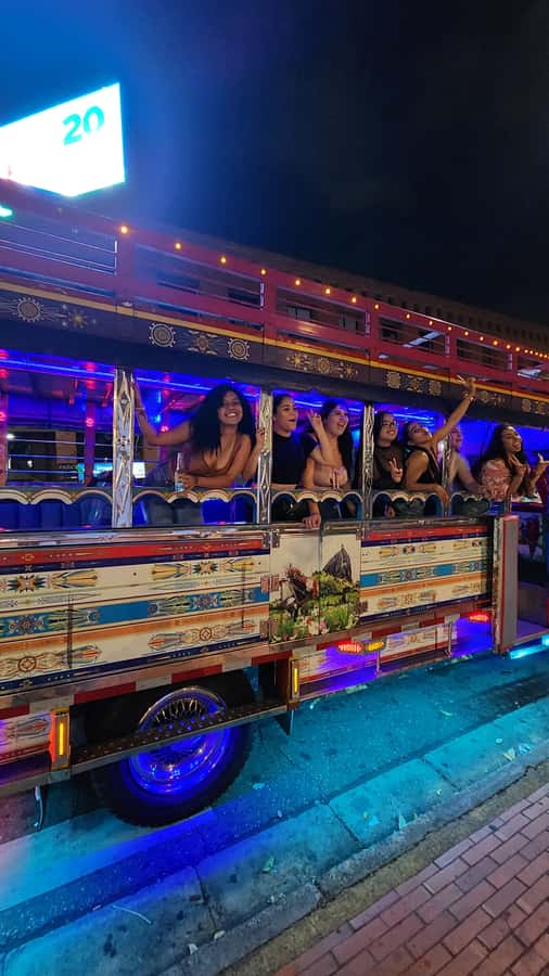 Medellin: Party Bus with DJ & Street Food Tastings - Music, language, and the social side