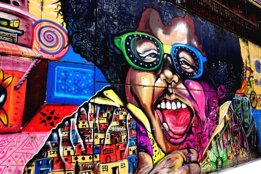 Medellín: Private Comuna 13 Street Art Tour - Starting in Poblado, where the first murals hide in plain sight
