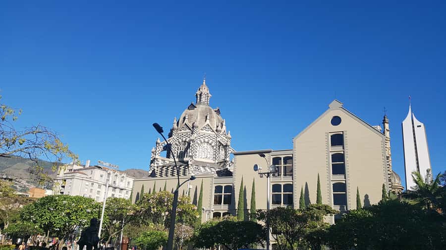 Medellín: Walking Tour with Cable Car and Botero Plaza - Walking through downtown churches, plazas, and the Cultural Palace
