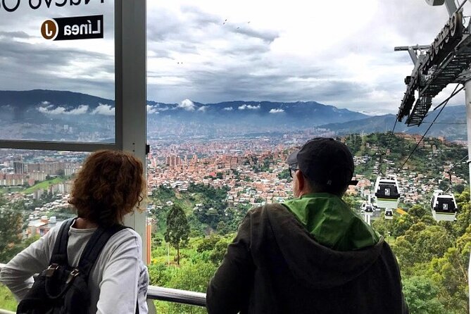 Private Tour to Comuna 13 & Exotic Fruit Market in Medellin! - Taking the San Javier cable car above the barrios