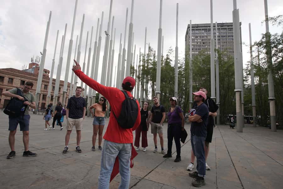 Shared Medellín Downtown Tour with Wireless Audio - Crossing Junín Street and the downtown passages